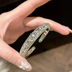 Vintage hollow flower zircon open bangle in silver finish with matte texture