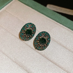 Vintage oval emerald earrings with sparkling crystals and bronze gold metal finish