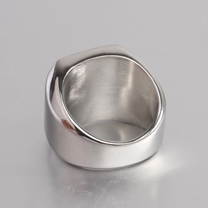 Close-up of polished 18mm silver square signet ring with smooth finish and inner brushed texture