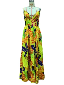 Close-up of tropical leaf print and V-neck detail on a summer bohemian maxi dress
