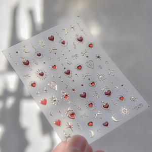 Detail of TO-4426 nail art stickers with 3D red hearts and golden moon star patterns