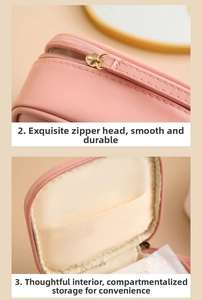 Detail of pink PU organizer featuring a gold zipper and internal divider pockets