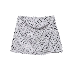 Chic silver sequin wrap mini skirt with shimmering polka dots and slim fit design