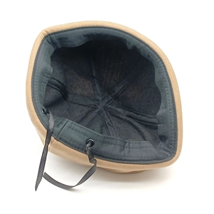 Internal details of khaki cat ear docker hat with black lining and adjustable strap