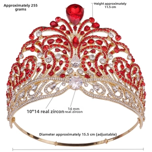 Detail view of gold tiara with red pear-shaped stone and white zircon wave patterns