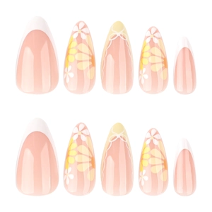 French almond press-on nails with floral patterns and yellow bow designs on white base