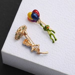 Cartoon frog enamel brooch with colorful balloons showing front and back pin structure