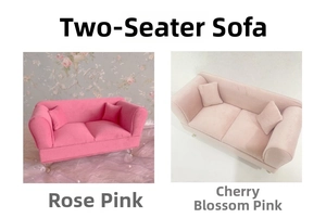 Detailed macro of miniature velvet double sofas in rose and cherry blossom pink colors