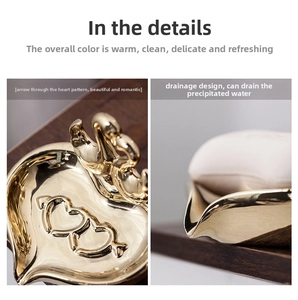 Detail of golden swan soap dish featuring double heart pattern and drainage slots