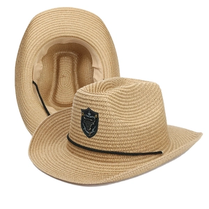 Detail of straw cowboy hat with bull head emblem and internal structure view