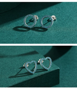 Macro detail of S925 sterling silver turquoise stud earrings with hollow design and hallmarked back