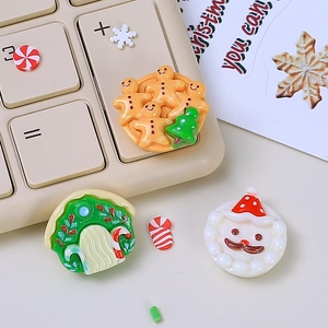 Cartoon Christmas resin charms set with gingerbread man and tree on a keyboard