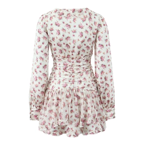 Detail view of floral long sleeve dress back with elastic waist and ruffled hem
