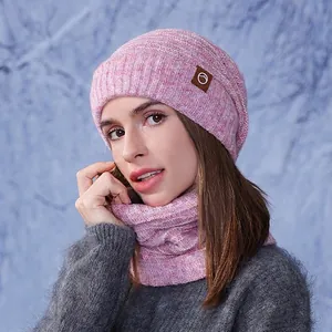 Women's pink knit beanie and scarf set with fleece lining for winter outdoor warmth