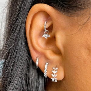 Detailed view of S925 silver earring set with leaf design and sparkling cubic zirconia