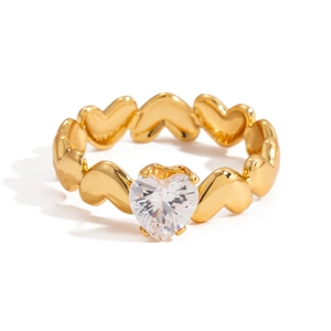 Macro shot of 18K gold heart-shaped ring band with a sparkling heart-cut zircon stone