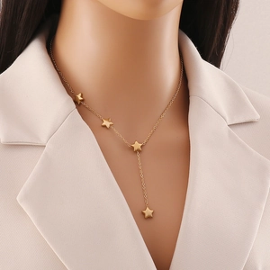 Elegant gold Y-shaped necklace featuring hanging star pendants on a delicate link chain
