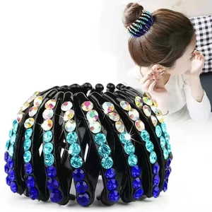 Detail of bird nest hair ring with sparkling gradient blue rhinestones and expandable base