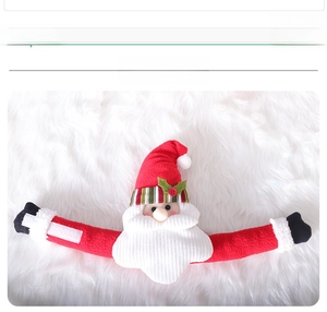 Detail of Santa Claus curtain tieback with velcro arms and soft plush holiday textures