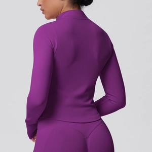 Detail of purple seamless ribbed knit yoga jacket with high neck and zip-up design