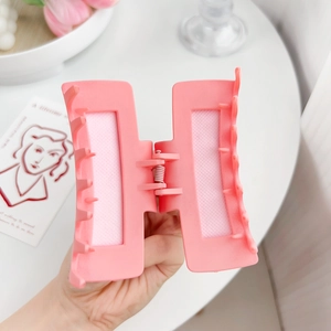 Pink matte square hair claw clip with heart-shaped detail for a romantic aesthetic