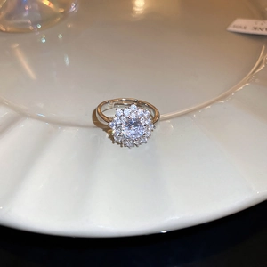 Close-up of snowflake rotating ring with sparkling zircon in a luxury floral design