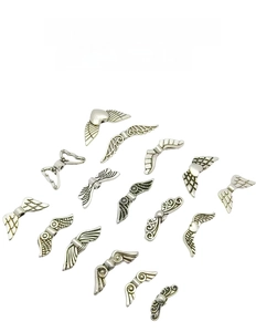 Macro view of vintage silver alloy angel wings beads for DIY jewelry making and crafts