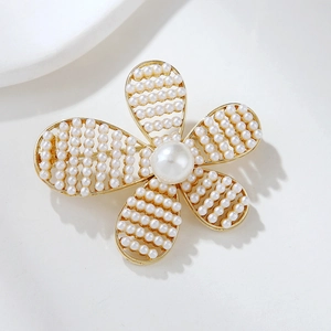 Elegant gold hollow camellia brooch with full pearl inlay for women accessory