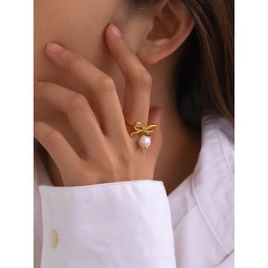 Elegant 18k gold plated stainless steel bow ring with white pearl pendant for women