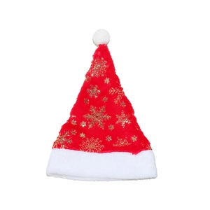 Detail of red plush Christmas hat featuring golden snowflake prints and white faux fur trim