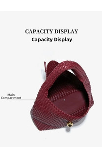 Detail view of large burgundy hand-woven leather tote bag with main capacity compartment