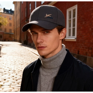 Detail of grey winter baseball cap with two-tone embroidery and warm fleece lining