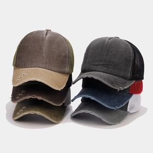 Detail of distressed brim and breathable mesh texture on vintage trucker caps