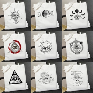 Harajuku style white tote bag featuring nine mystical Egyptian Demon Eye printed designs
