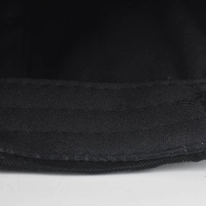 Detail of the stitching and interior sweatband on the black washed cotton baseball cap