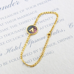 18k gold plated bracelet with A-letter abalone shell pendant on a Figaro chain