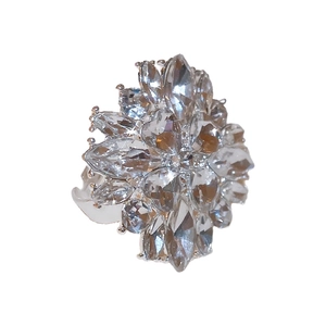 Elegant silver sunflower ring with sparkling cubic zirconia crystals on white background