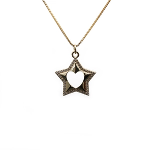 Minimalist gold star necklace with heart cutout and sparkling cubic zirconia stones