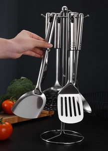 Polished 1mm thick stainless steel kitchen utensil set hanging on a rotating storage rack