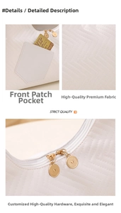 Detail showing white faux leather bag texture with V-shaped embossing and golden zipper
