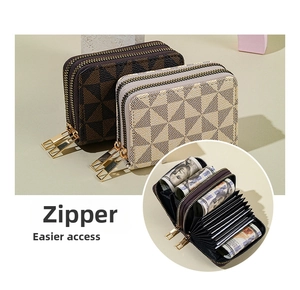 Macro detail of checkered PU leather accordion card holder with dual golden zippers