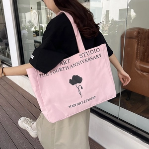 Pink canvas tote bag with black floral art print and minimalist large capacity design