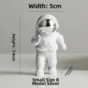 Detailed view of a silver astronaut figurine in dynamic pose with size dimensions