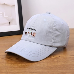 Detailed close-up of light blue lamb wool baseball cap with cute animal embroidery