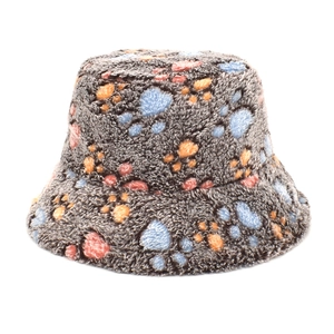 Detail of plush bucket hat featuring colorful paw prints on soft grey faux fur texture