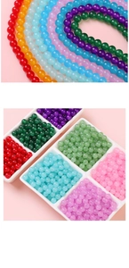 Close-up of colorful round glass beads in rainbow colors for DIY jewelry making crafts