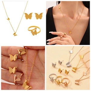 Macro detail of butterfly jewelry set showing frosted texture earrings, necklace, and ring