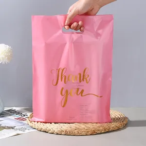 Pink PE shopping bag with gold Thank You print and reinforced die-cut handle detail