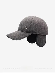 Detail view of winter baseball cap showing thick wool texture and side metal brand tag
