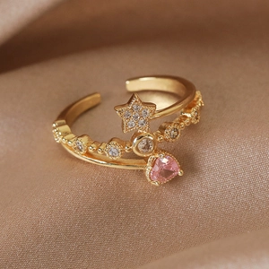 Detailed macro view of gold-plated double-layer ring with pink heart and star zircon
